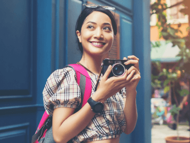 portrait-pretty-young-hipster-woman-having-fun-city-with-camera-1-2